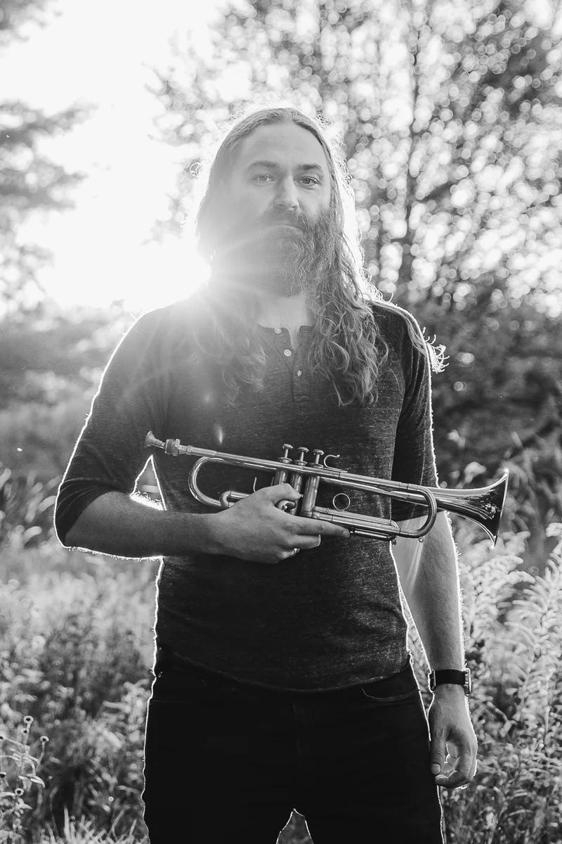 Ross Huff holding a trumpet